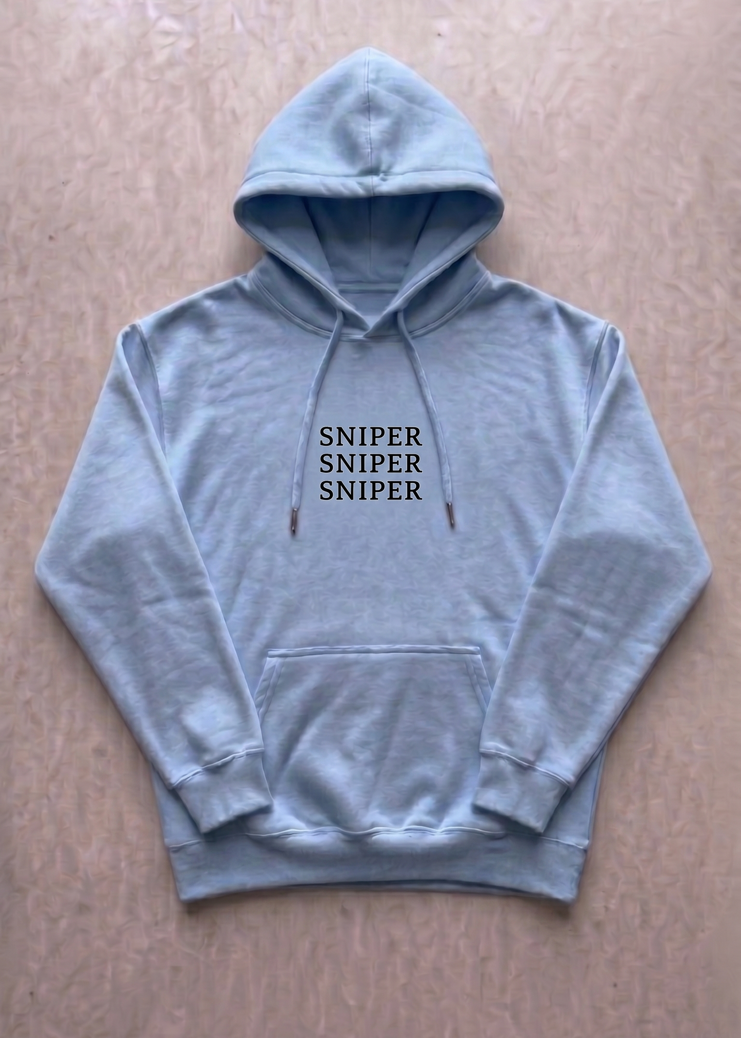 blue hoodie with 'SNIPER SNIPER SNIPER' text on a beige background