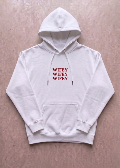 White hoodie with 'WIFEY' text printed in red on a beige background